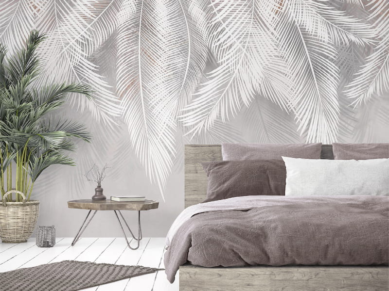 Fototapeta Puszyste liście palmowe we wnętrzu sypialni